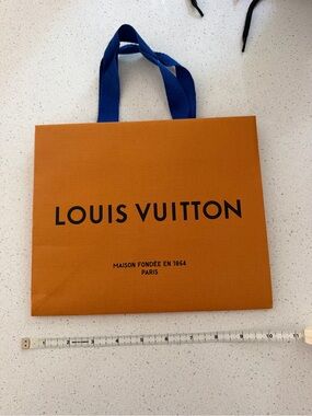 Real Louis Vuitton Orange Bag with Blue Handles and Black Logo